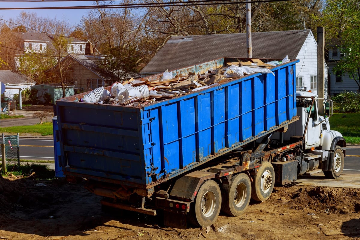 Garage cleanout with unwanted items ready for hauling